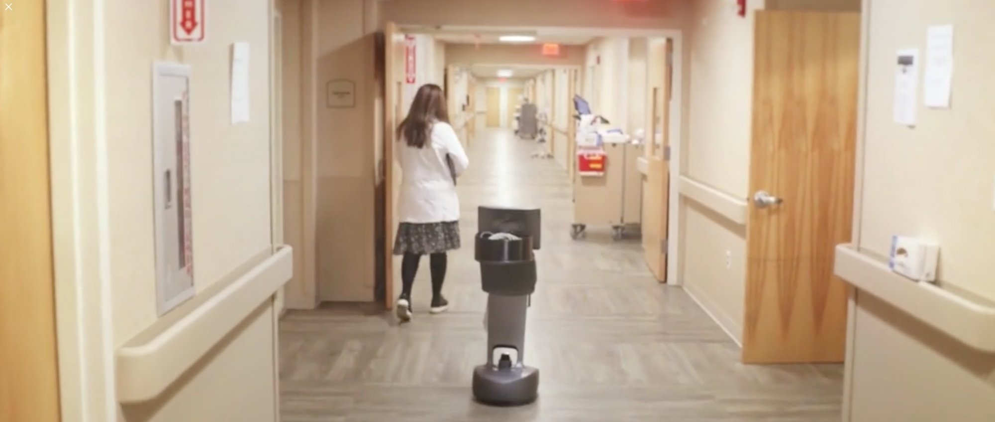 Telepresence robot navigating a skilled nursing facility hallway